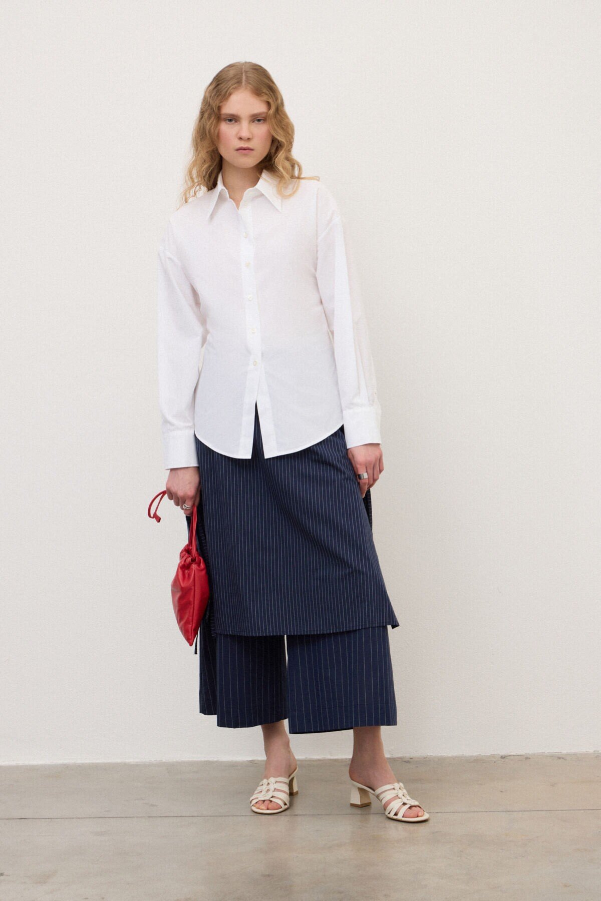 Trousers with overlapping skirt